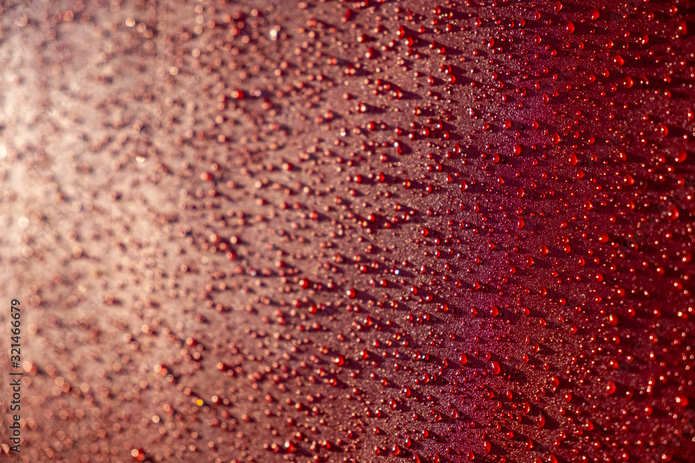 Droplets pattern on red backdrop. Juice splash. Red juicy surface drops, great design for any purposes. Texture background, pattern. Summer bright background. Bright sweet color.