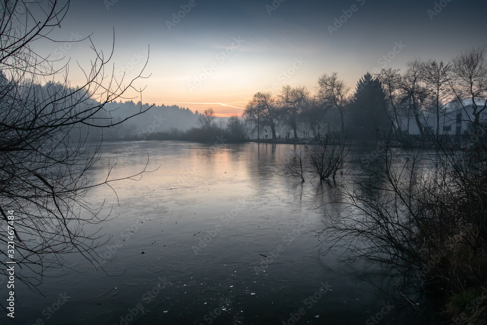 beautiful view on a frozen lake in winter season in beautiful sunset and mountains beautiful view on a frozen lake in winter season in beautiful sunset and mountains