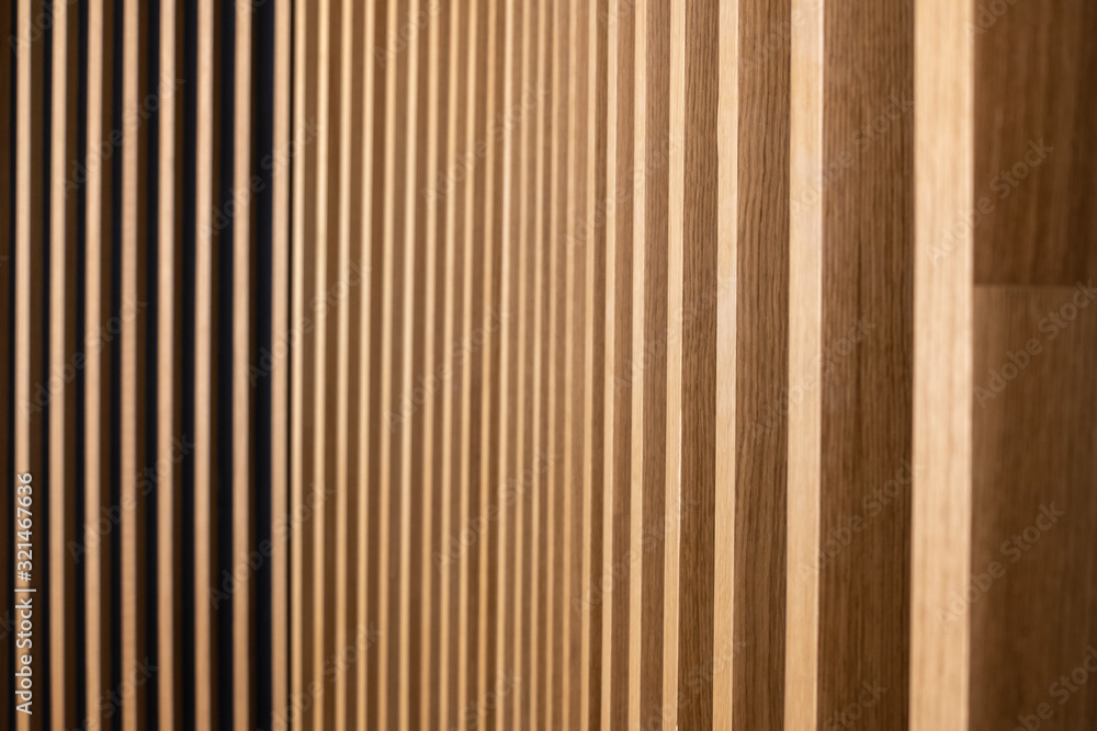 Obraz premium Wall decorated with wooden planks. Futuristic geometric wall design. Wood texture.