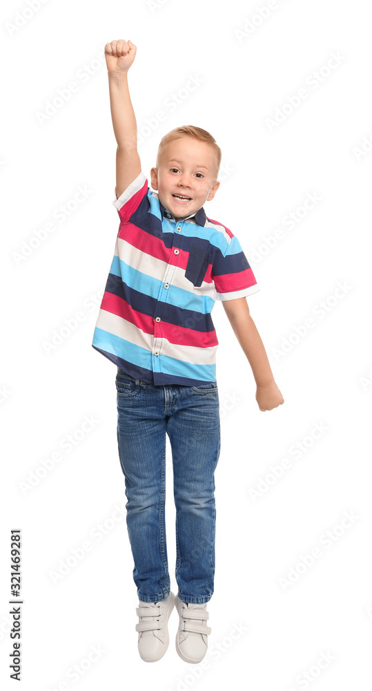 Cute little boy jumping on white background