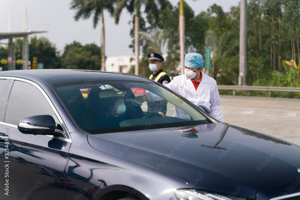The coronavirus check post on highway. Doctors checking body temperature. The coronavirus check post on highway. Doctors checking body temperature.