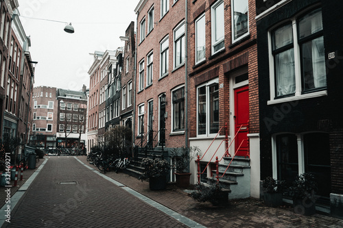 street in the city with red door
