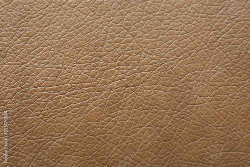 Texture of light brown leather as background, closeup