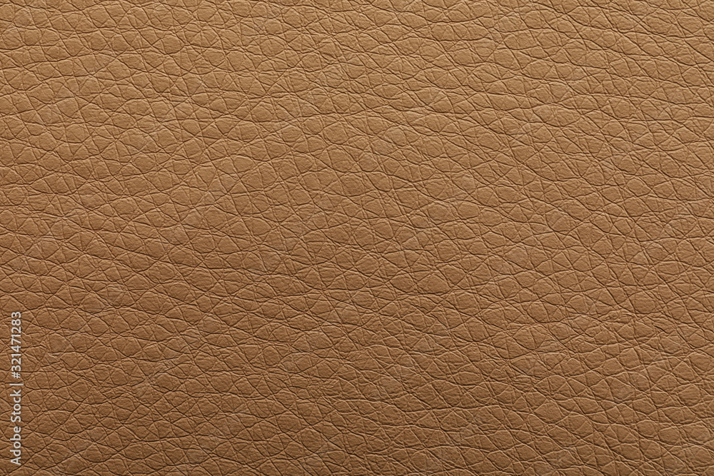 Texture of light brown leather as background, closeup Texture of light brown leather as background, closeup