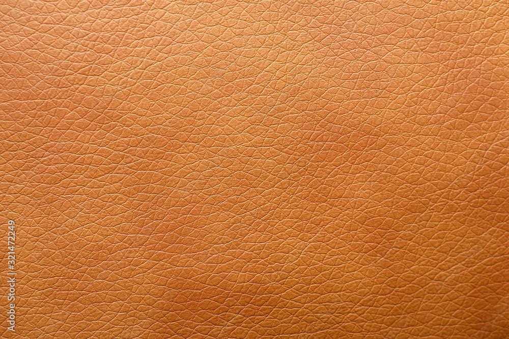 Texture of orange leather as background, closeup Texture of orange leather as background, closeup