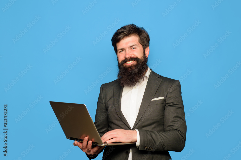 Businessman with computer at office. Office, business, technology, internet. Serious man with laptop computer at office. Business man working with laptop. Businessman working with notebook in office. Businessman with computer at office. Office, business, technology, internet. Serious man with laptop computer at office. Business man working with laptop. Businessman working with notebook in office.