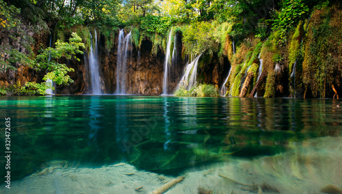 Plitvice lakes, Croatia. Beautiful place visited by thousands of tourists every year.  © belyaaa
