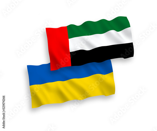 National vector fabric wave flags of United Arab Emirates and Ukraine isolated on white background. 1 to 2 proportion.