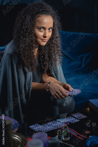 Young lady holding a deck of cards