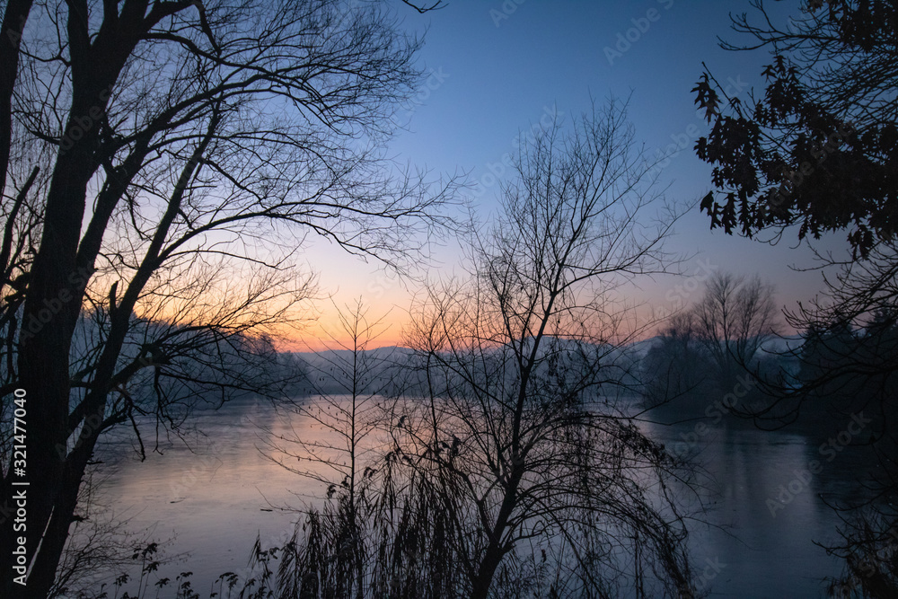 beautiful view on a frozen lake in winter season in beautiful sunset and mountains beautiful view on a frozen lake in winter season in beautiful sunset and mountains