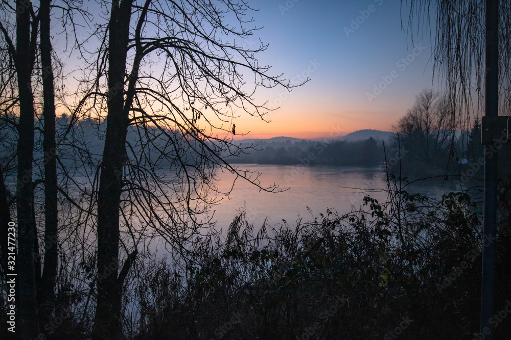 beautiful view on a frozen lake in winter season in beautiful sunset and mountains beautiful view on a frozen lake in winter season in beautiful sunset and mountains