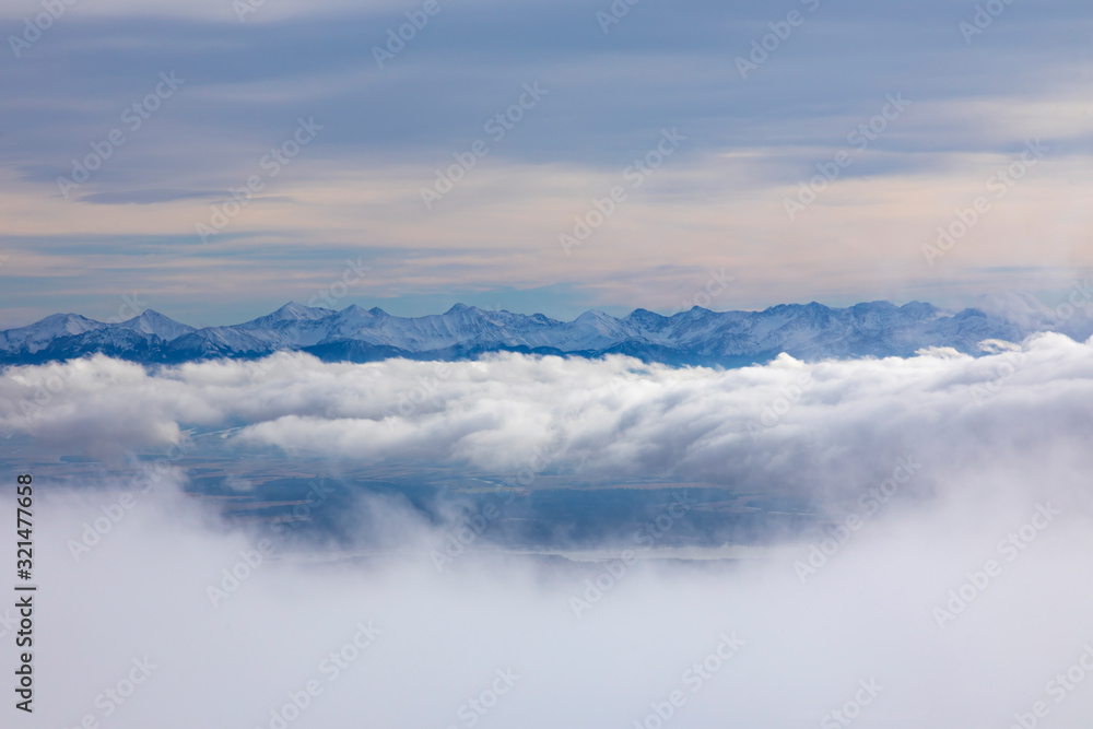West Tatras mountains over the clouds from Babia Hora hill, Slovakia