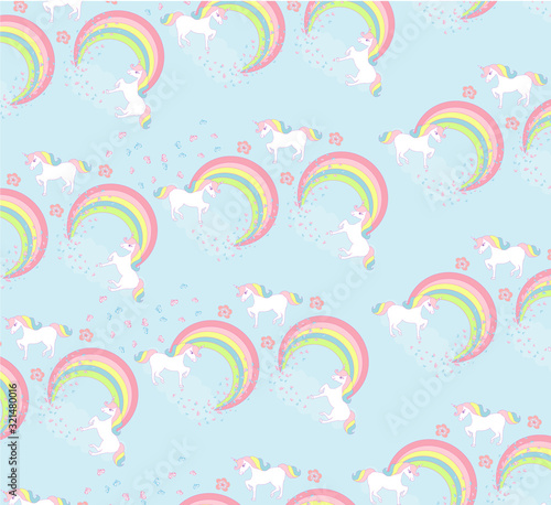 Seamless pattern with cute unicorns and rainbow