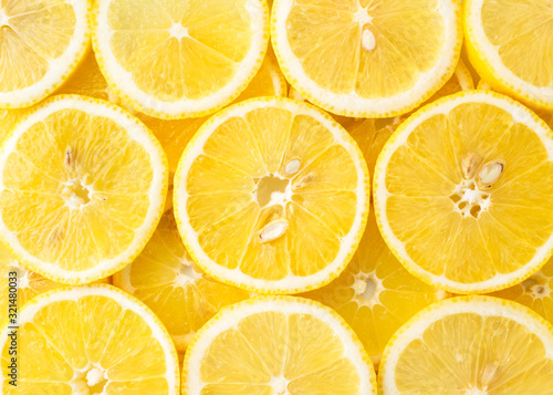 Abstract background of lemon slices top view.