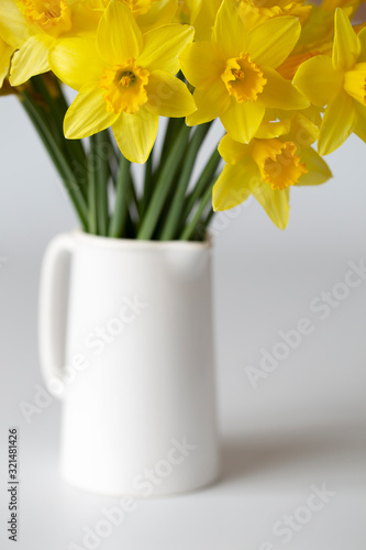 Daffodil yellow flowers bunch vase white spring time simple minimal calm