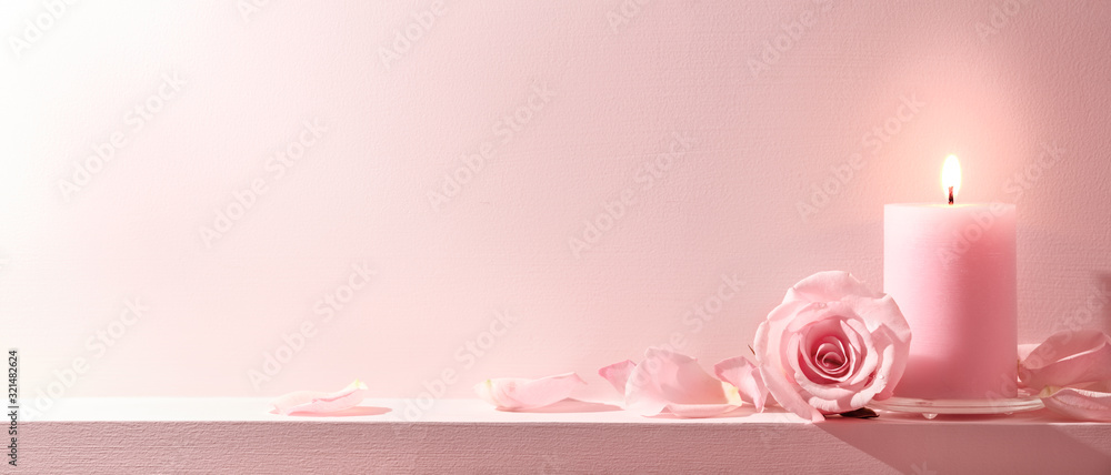 Pink Roses and candle on a pink background - obrazy, fototapety, plakaty 