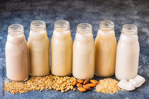 Billede på lærred A bottles of alternative  milk and ingredient