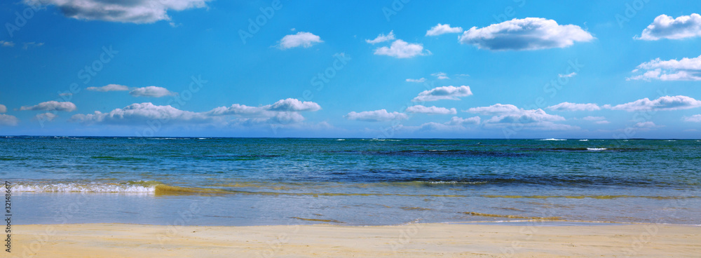 Caribbean sea and blue sky with clouds. Travel background.