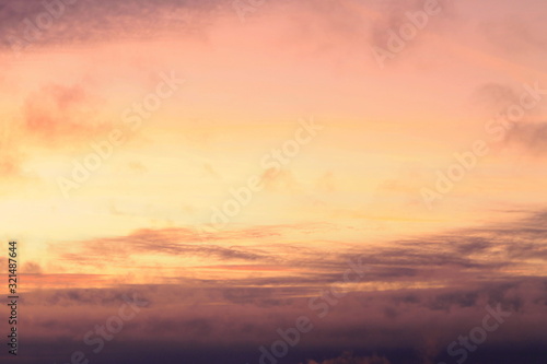 A beautifully backlit colorful sunset sky with the colors of sunrise and sunset.