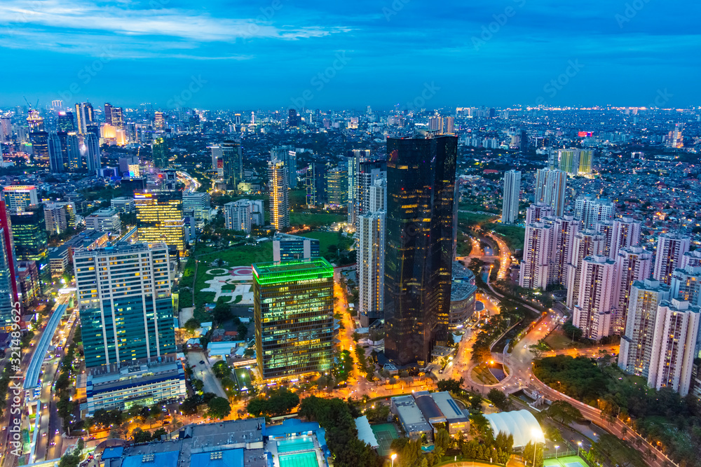 Fototapeta premium Aerial view of Jakarta Central Business District (Sudirman and Kuningan) at sunset/dusk.