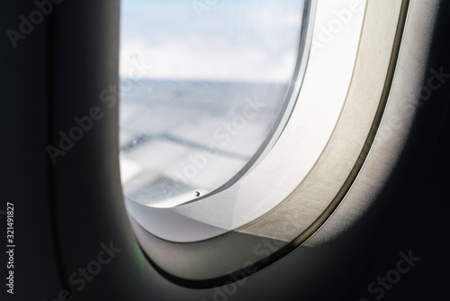 Obraz na płótnie Sunlight coming in through window in airplane w salonie