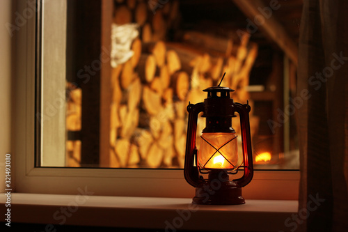 Kerosene lamp on the window. Old lamp