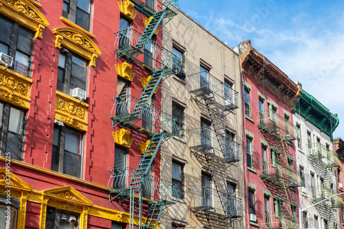 Colorful Old Buildings in Chinatown New York City with Fire Escapes