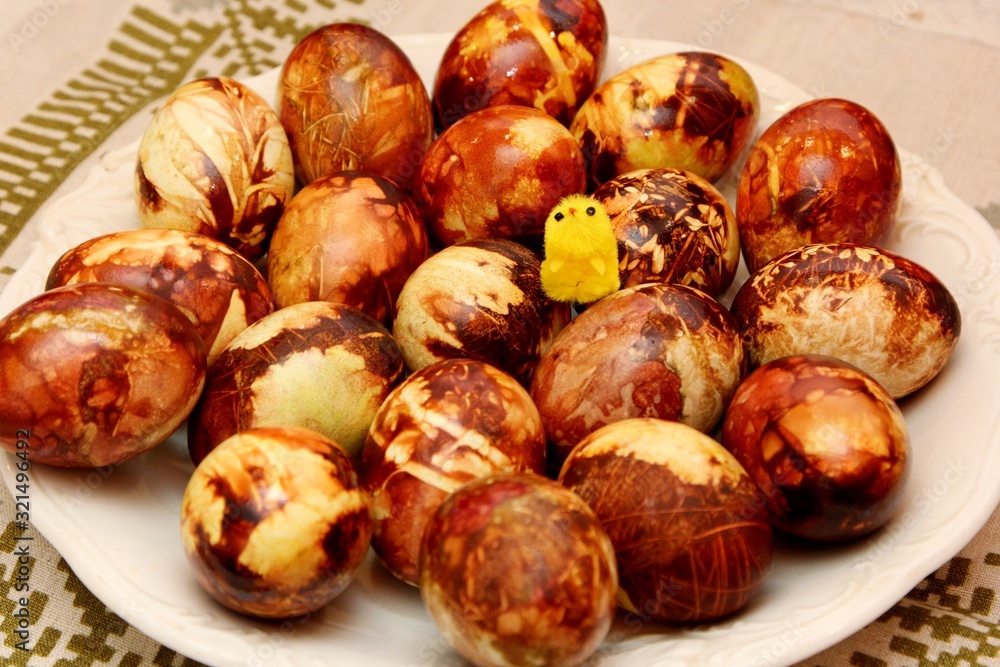 Yellow and brown Easter eggs painted in natural onion bark. Easter egg in old traditional latvian style Yellow and brown Easter eggs painted in natural onion bark. Easter egg in old traditional latvian style