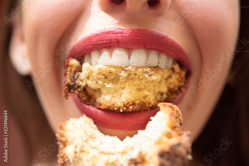 Hunger. Closeup of woman eating. Meal. Female lips. Closeup woman face. Mouth wide open.