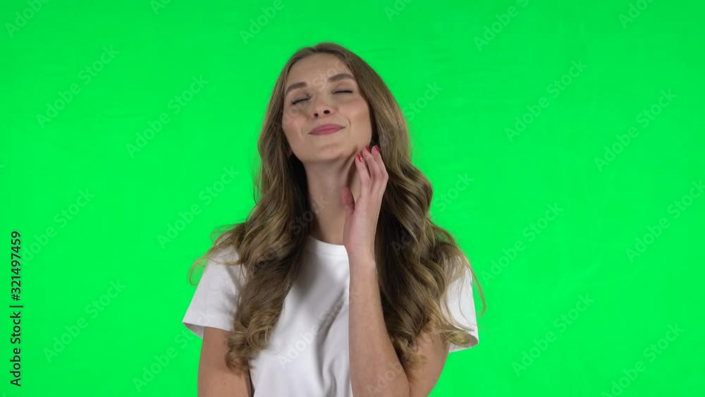 Lovable girl daydreaming and smiling looking up. Green screen Lovable girl daydreaming and smiling looking up. Green screen