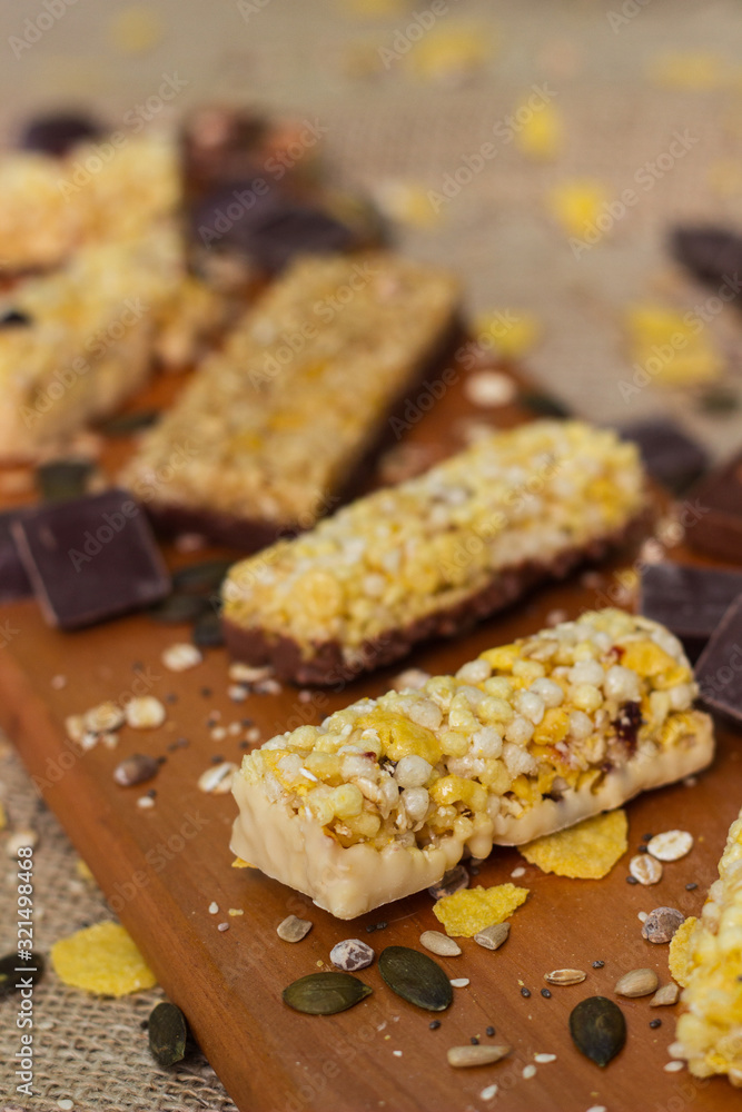 Granola Bars and mixed nuts. Honey bars with peanuts, chocolate, dried fruit, sesame and sunflower seeds Granola Bars and mixed nuts. Honey bars with peanuts, chocolate, dried fruit, sesame and sunflower seeds