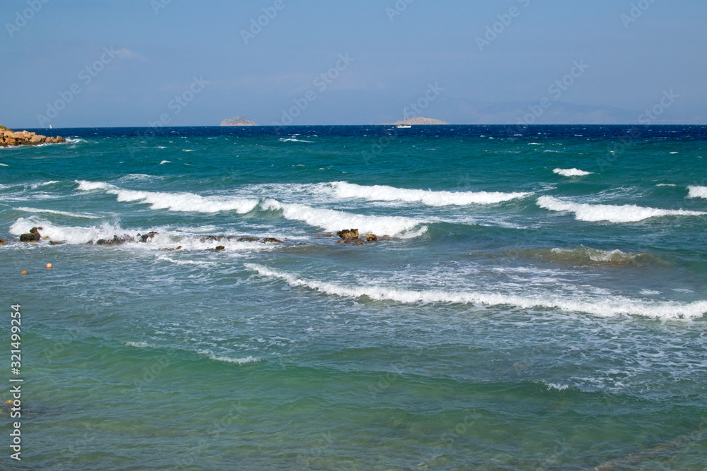 Waves on the shore of the Mediterranean Sea on an island in Greece. Waves on the shore of the Mediterranean Sea on an island in Greece.