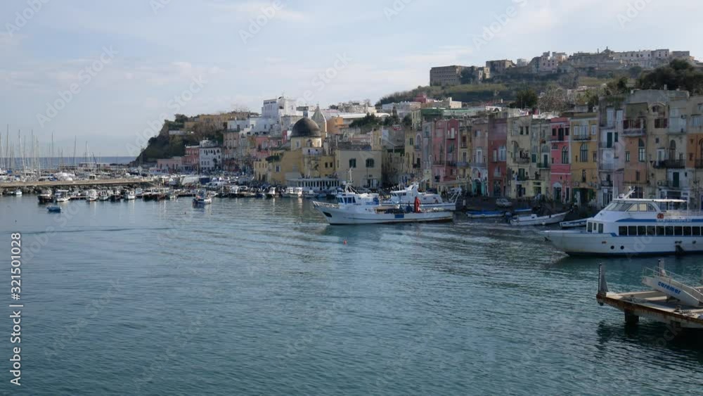 Campi Flegrei, Naples, Campania, Italy - Decemeber 5 2019: the pastel colors of Marina Corricella in the port of Procida Campi Flegrei, Naples, Campania, Italy - Decemeber 5 2019: the pastel colors of Marina Corricella in the port of Procida