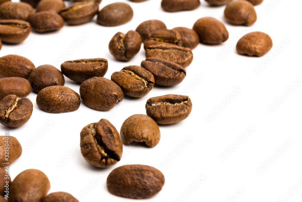 Coffee. roasted coffee beans on white background in close-up Coffee. roasted coffee beans on white background in close-up