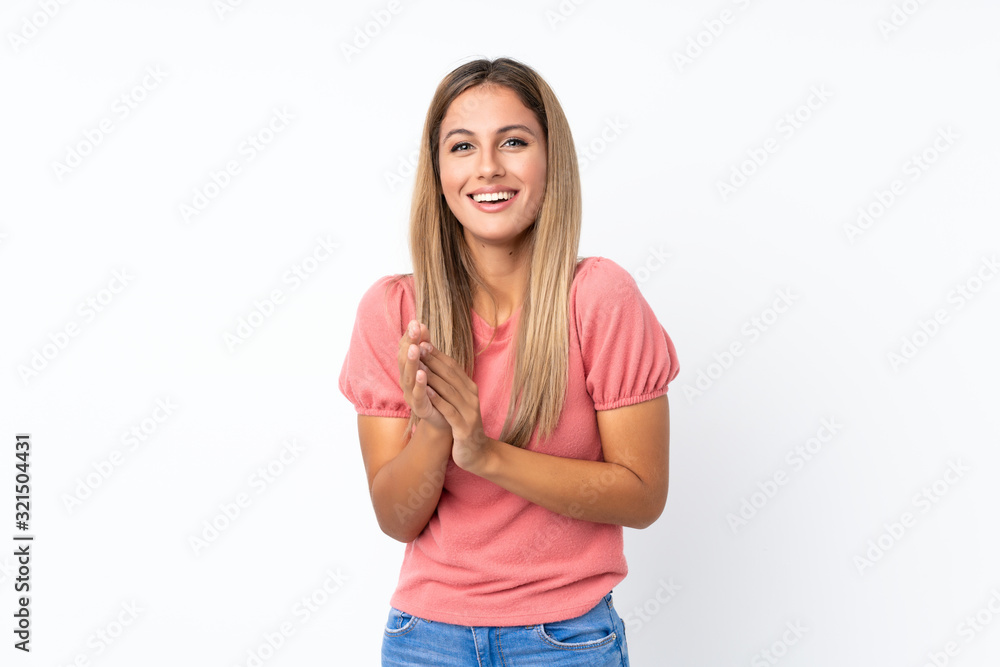 Young blonde woman over isolated white background applauding after presentation in a conference Young blonde woman over isolated white background applauding after presentation in a conference