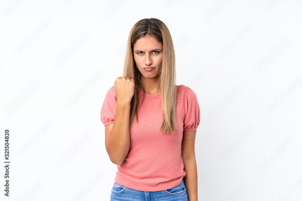 Young blonde woman over isolated white background with angry gesture Young blonde woman over isolated white background with angry gesture