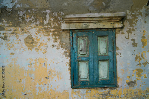 Vintage green window of old wall in Thailand. © K.Pornsatid