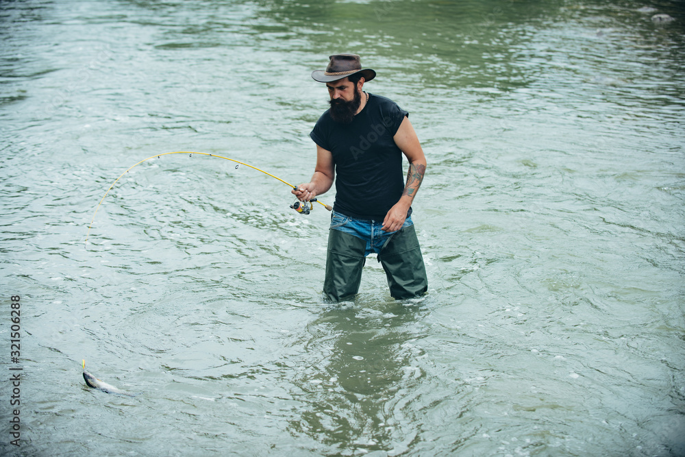 Man fishing on river. Summer vacation. Hobby sport activity. Guy in hat. Fish on hook. Fish normally caught in wild. Pothunter. Nice day for fishing. Senior man fishing. Man fishing on river. Summer vacation. Hobby sport activity. Guy in hat. Fish on hook. Fish normally caught in wild. Pothunter. Nice day for fishing. Senior man fishing.