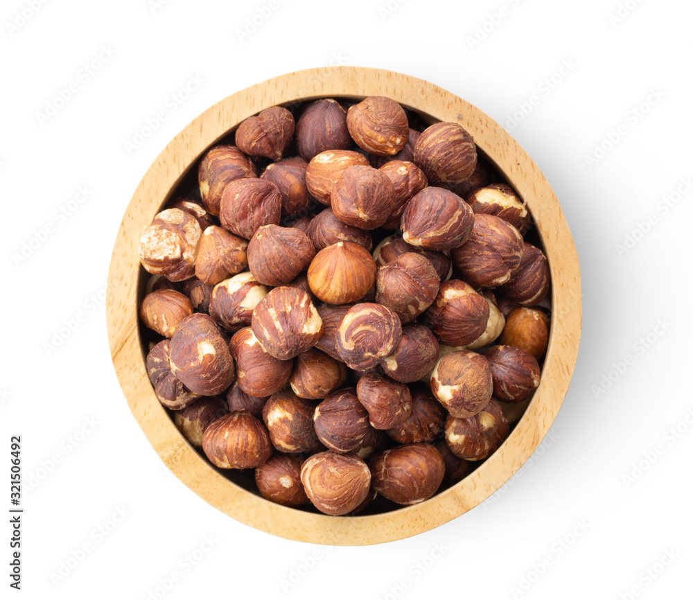 hazelnuts in wood bowl isolated on white background hazelnuts in wood bowl isolated on white background