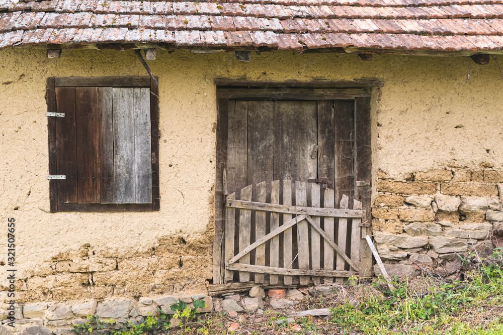 Windows and door on old abandoned village house