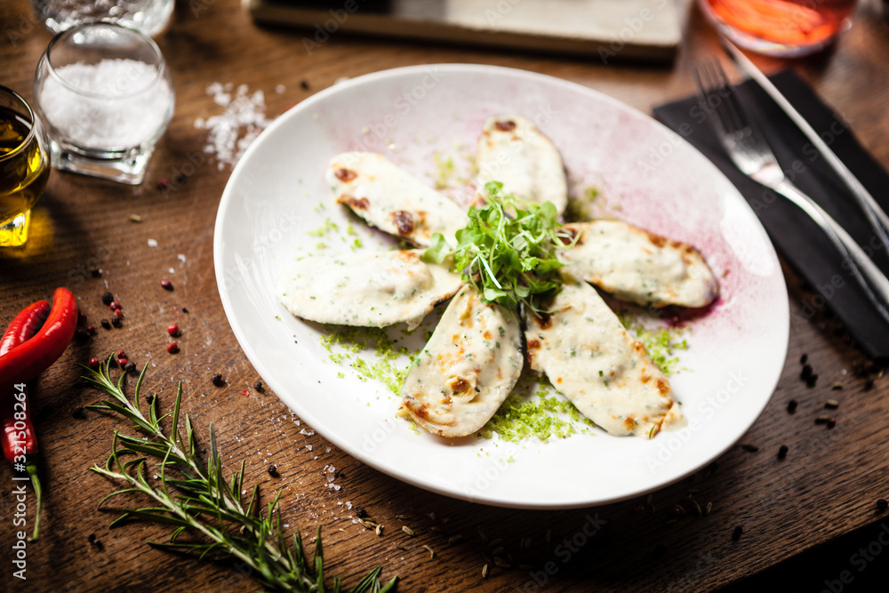 Cooked green mussels with parmegano and cream cheese