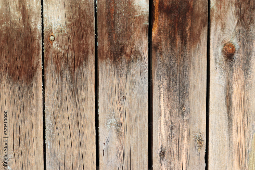 Naklejka premium Old wooden board, wood wall. Brown weathered panels texture with knots for background
