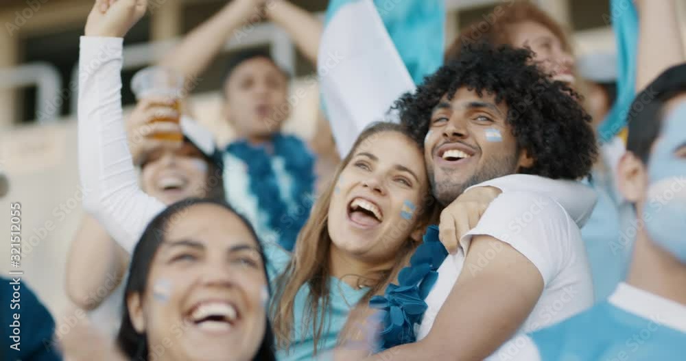 Group of cheering soccer fans from Argentina. Crowd of soccer fans