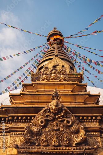 Buddhist building, the Swayambhunath Stupa or monkey temple during the day and its prayer flags fluttering in the wind, Nepal, Kathmandu