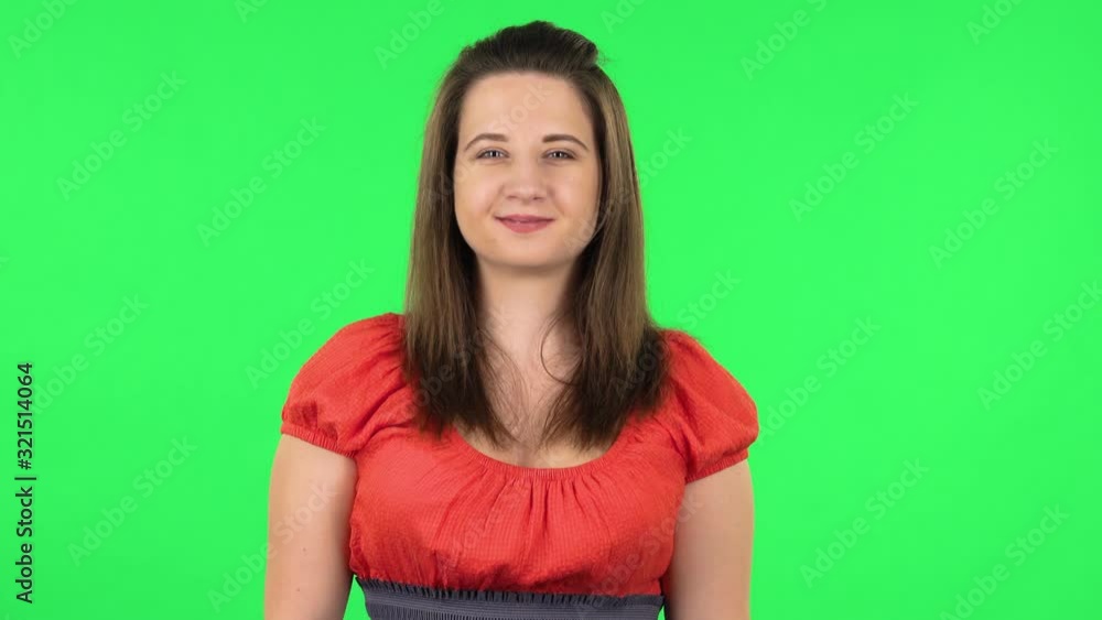 Portrait of cute girl smiling while looking at camera. Green screen Portrait of cute girl smiling while looking at camera. Green screen
