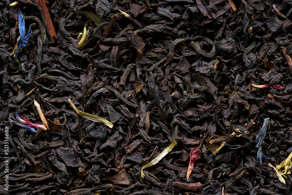 A scattering of elite black tea on a white background A scattering of elite black tea on a white background