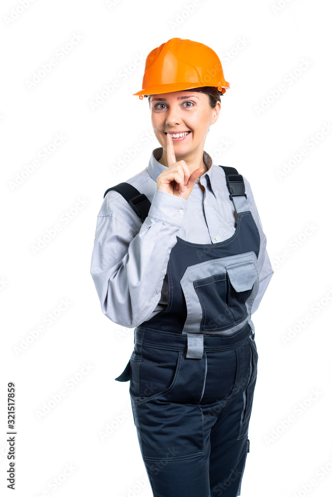 The head of the female construction team smiles and gestures silence to everyone. Isolated The head of the female construction team smiles and gestures silence to everyone. Isolated