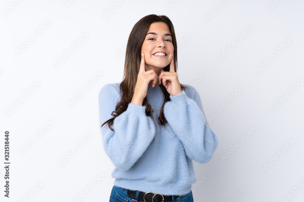 Teenager girl over isolated white background smiling with a happy and pleasant expression Teenager girl over isolated white background smiling with a happy and pleasant expression