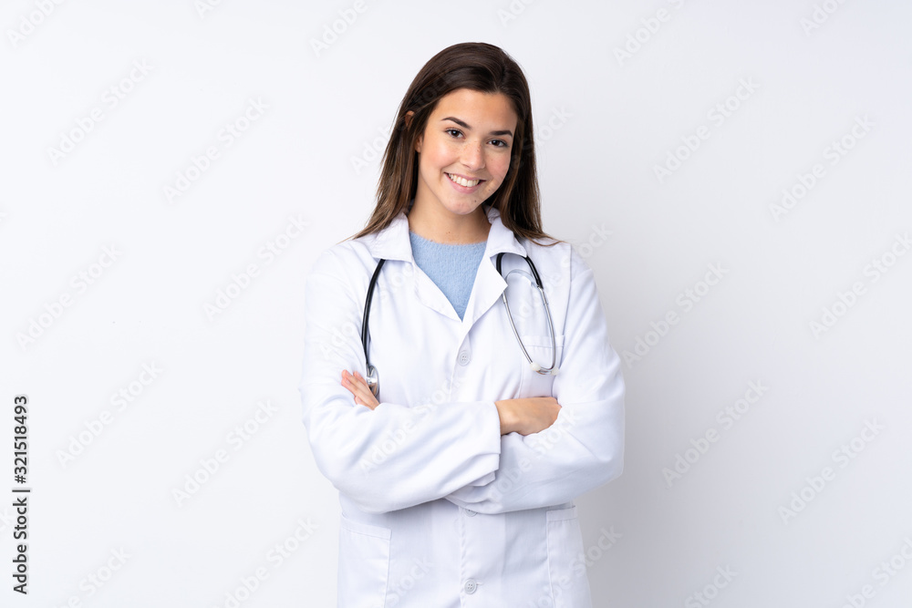 Teenager girl over isolated white background wearing a doctor gown and with arms crossed Teenager girl over isolated white background wearing a doctor gown and with arms crossed