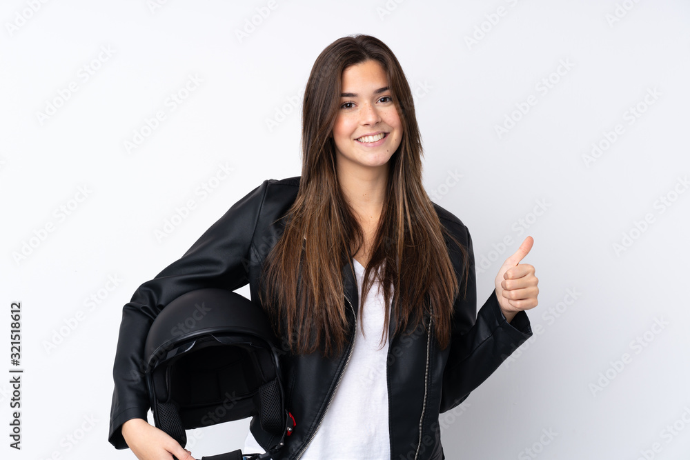Young woman with a motorcycle helmet over isolated white background giving a thumbs up gesture Young woman with a motorcycle helmet over isolated white background giving a thumbs up gesture